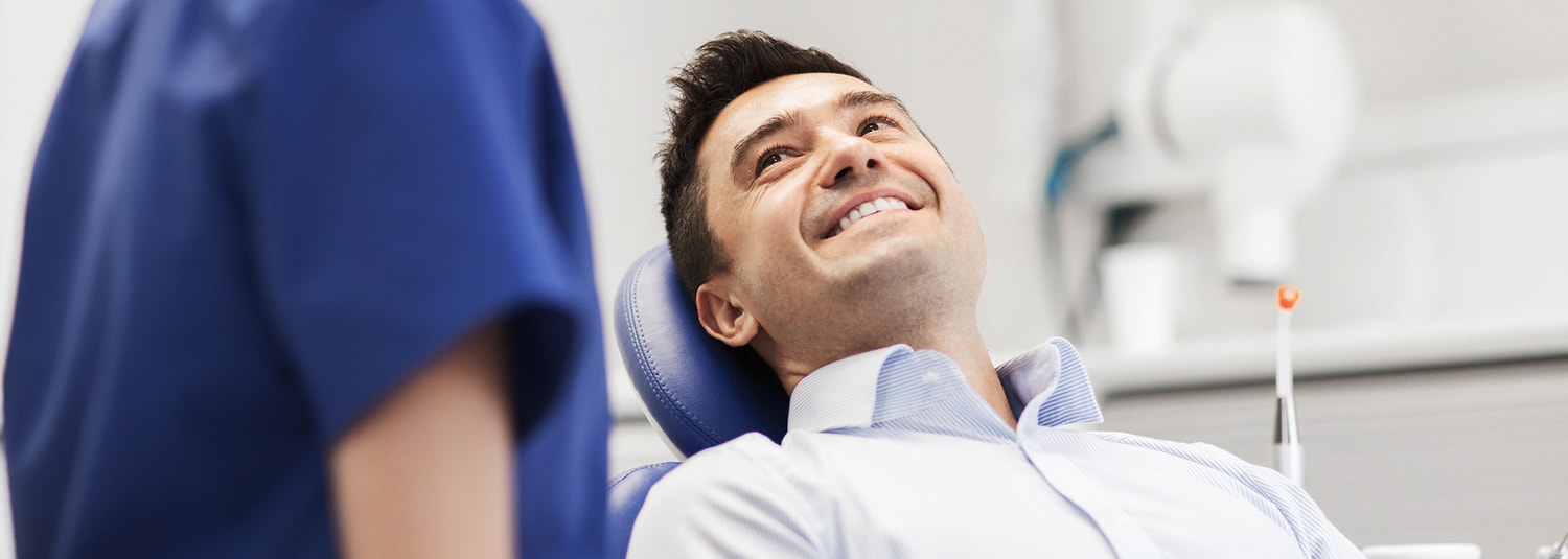 Man Sitting In Dental Chair